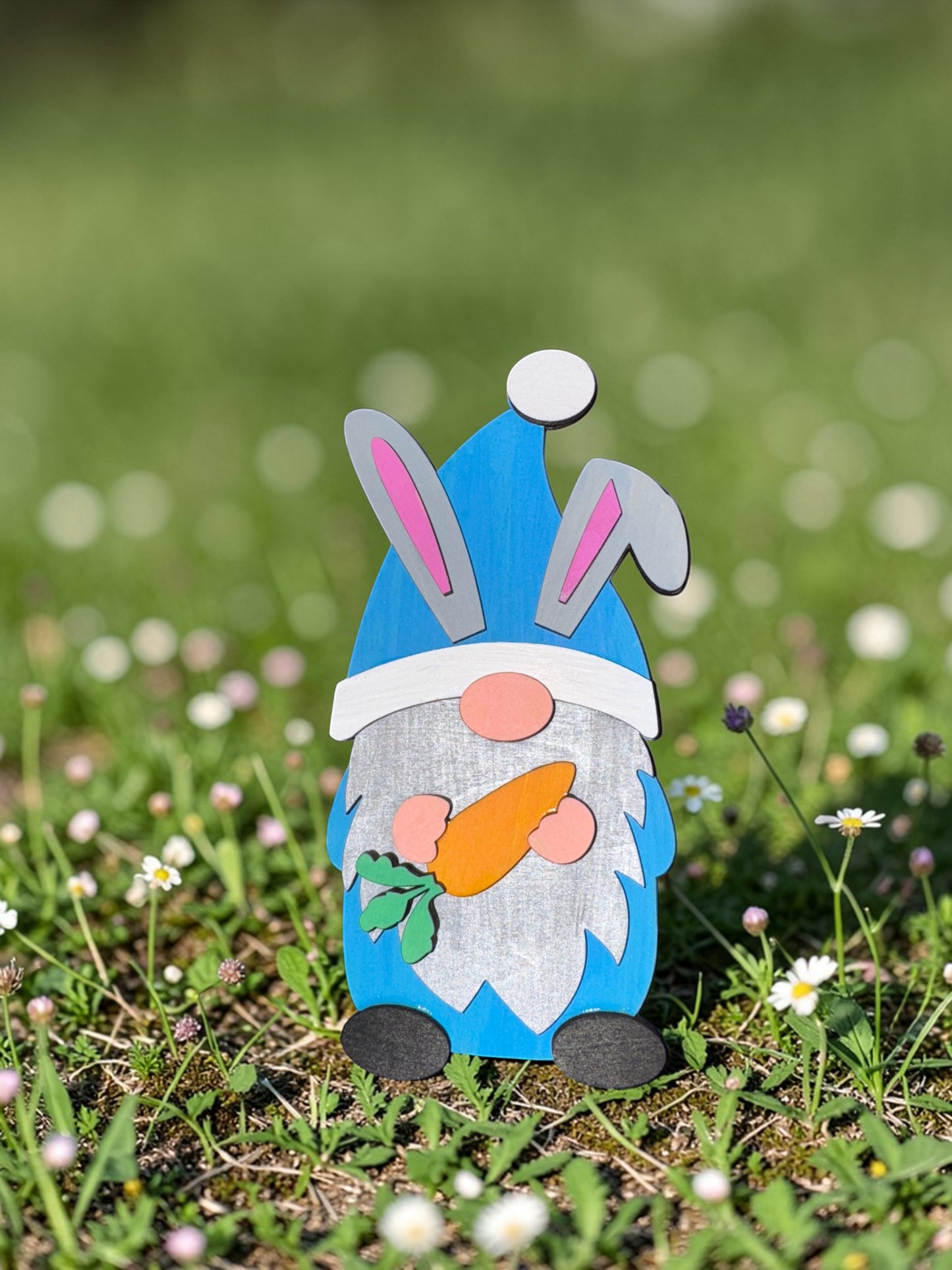 C2 Creative Crafts blue Easter gnome with bunny ears, holding a carrot, and a fluffy white beard.