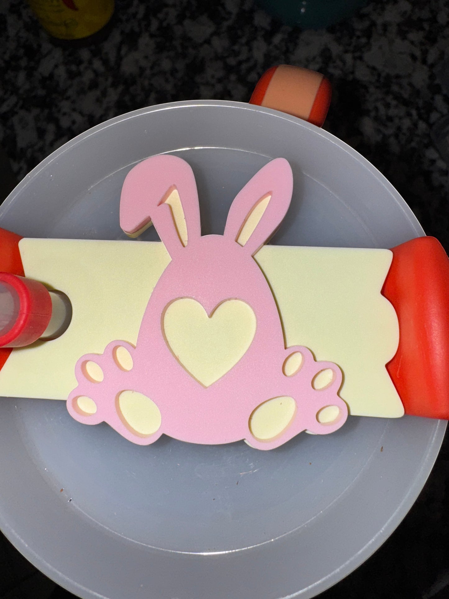 C2 Creative Crafts pink bunny acrylic Stanley cup topper with heart detail on pale yellow background.
