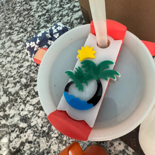 C2 Creative Crafts acrylic Stanley cup topper with palm tree, sun, and water design. Fits 20-40 oz lids.