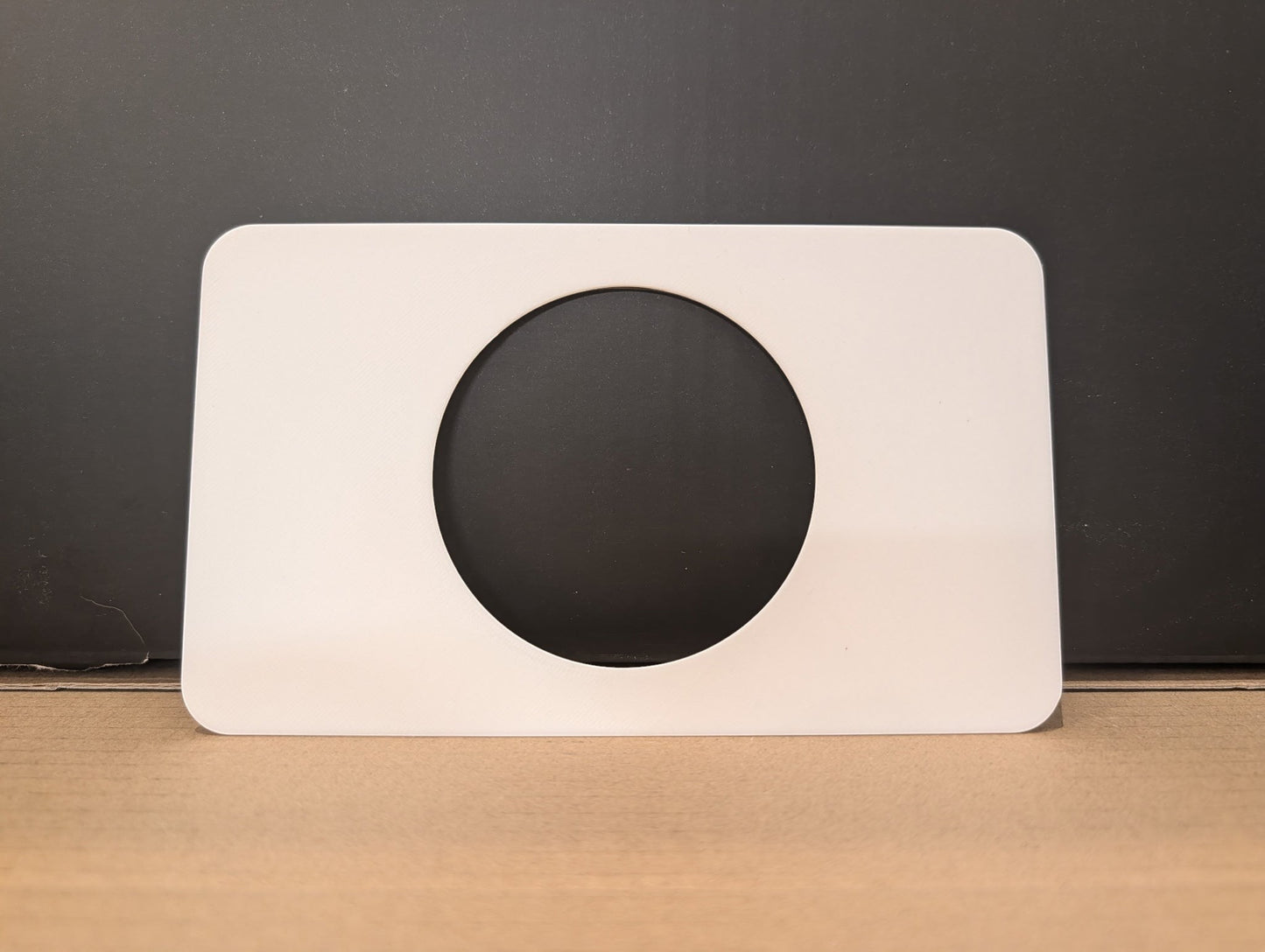 C2 Creative Crafts white stoma protector base plate with 2 7/8in hole, 4in x 6 3/4in, 2mm thick.