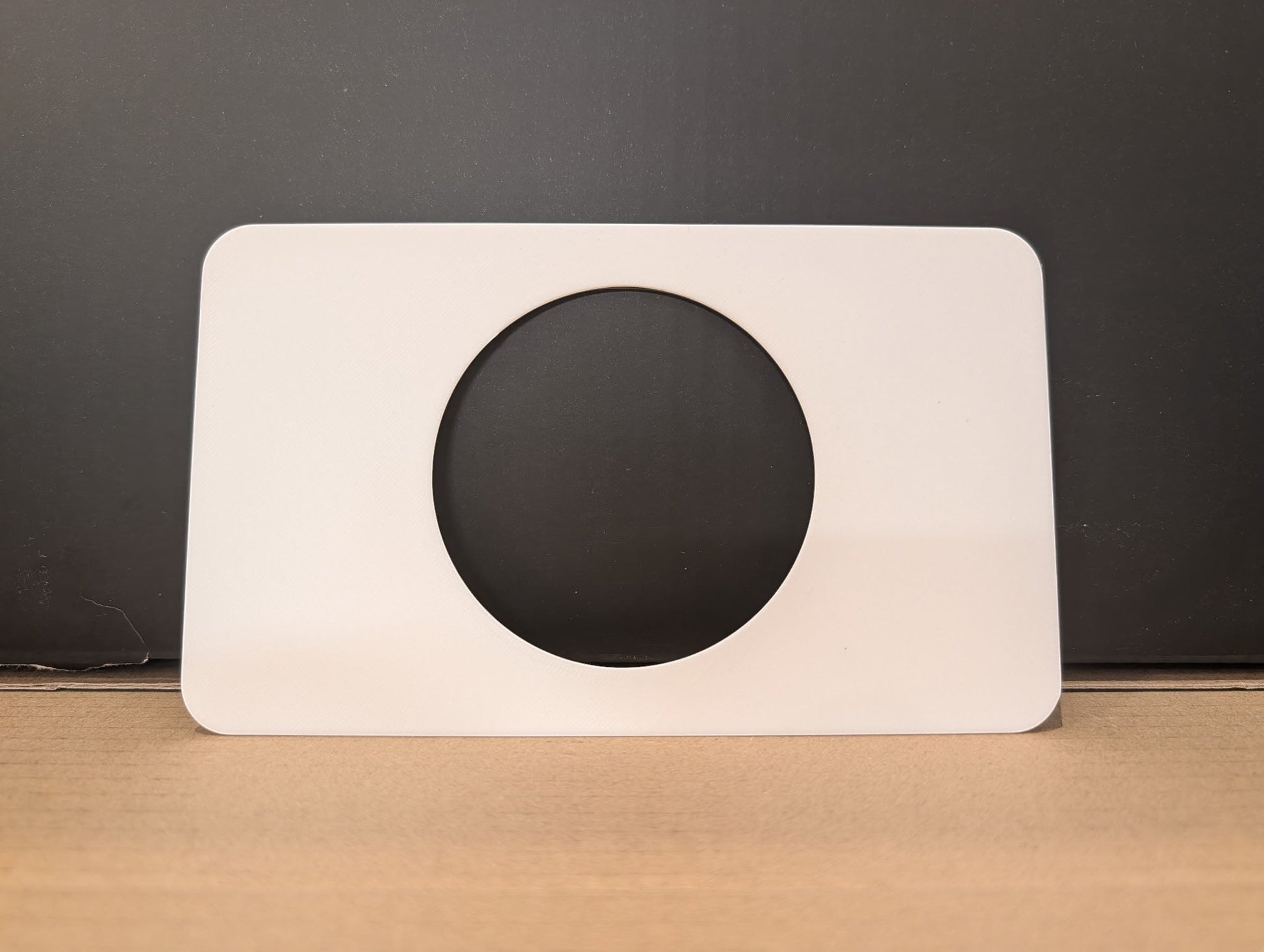 C2 Creative Crafts white stoma protector base plate with 2 7/8in hole, 4in x 6 3/4in, 2mm thick.